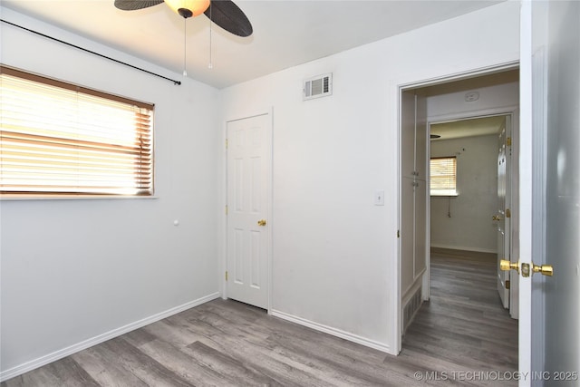 20529 E 4th St, Tulsa, OK 74108 - unfurnished bedroom featuring wood finished floors and a ceiling fan