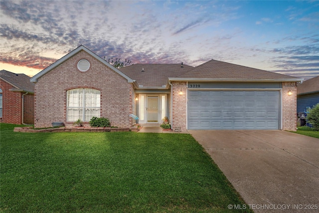 3220 N 3rd Pl, Broken Arrow, OK 74012 - single story home with brick siding, concrete driveway, a front lawn, and an attached garage