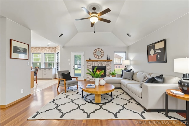 3220 N 3rd Pl, Broken Arrow, OK 74012 - living room with a ceiling fan, light wood-style floors, vaulted ceiling, and a fireplace