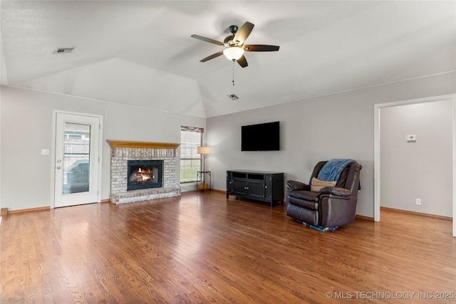 3220 N 3rd Pl, Broken Arrow, OK 74012 - unfurnished living room with ceiling fan, lofted ceiling, wood finished floors, and a fireplace
