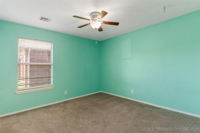 3220 N 3rd Pl, Broken Arrow, OK 74012 - carpeted spare room featuring a ceiling fan and baseboards