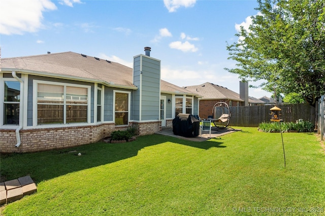 3220 N 3rd Pl, Broken Arrow, OK 74012 - back of house featuring a fenced backyard, a patio area, brick siding, and a chimney