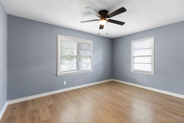 10942 E 4th Pl N, Tulsa, OK 74128 - empty room with a ceiling fan, light wood-style flooring, and a textured ceiling