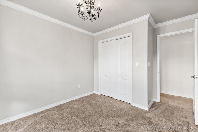 1505 Augusta, Ada, OK 74820 - unfurnished bedroom featuring carpet floors, a chandelier, ornamental molding, and a closet