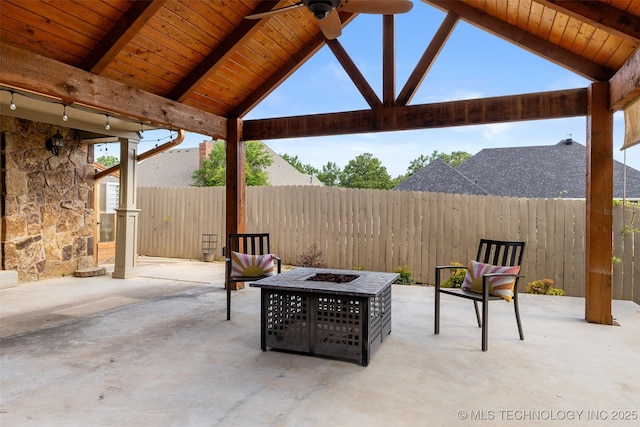 1505 Augusta, Ada, OK 74820 - fenced backyard featuring a fire pit, ceiling fan, and a patio area
