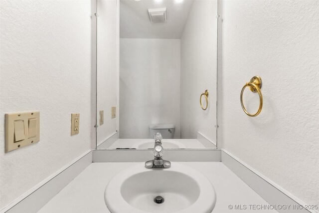 1505 Augusta, Ada, OK 74820 - bathroom with vanity and toilet