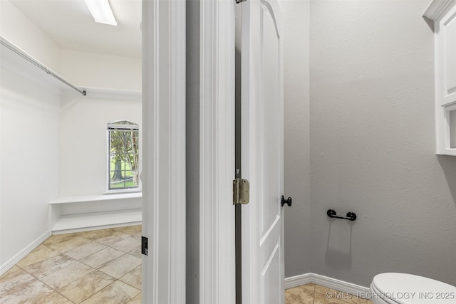 1505 Augusta, Ada, OK 74820 - bathroom with toilet and baseboards