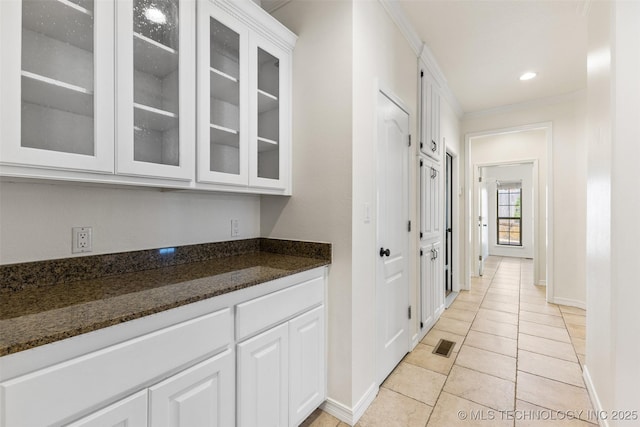 1505 Augusta, Ada, OK 74820 - hallway featuring light tile patterned floors and crown molding