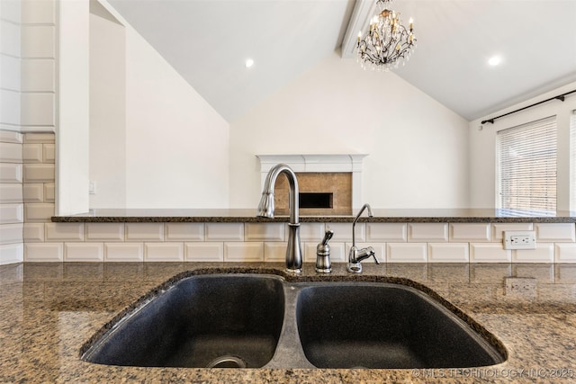 1505 Augusta, Ada, OK 74820 - kitchen view of dark stone counters, recessed lighting, and a chandelier