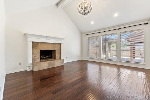 1505 Augusta, Ada, OK 74820 - unfurnished living room with dark wood finished floors, a chandelier, beam ceiling, a fireplace, and high vaulted ceiling