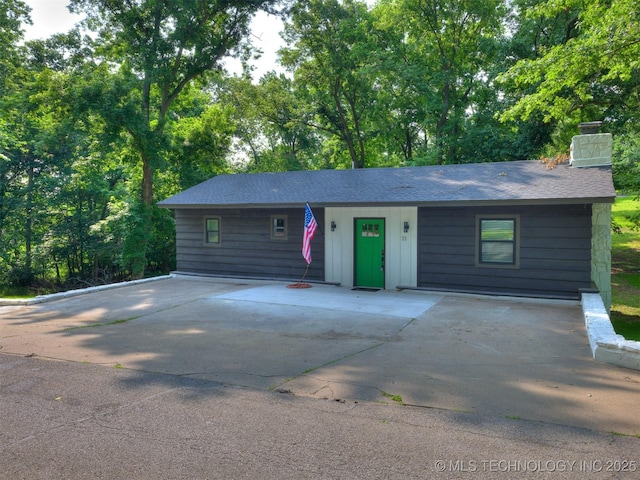11 Port Duncan, Afton, OK 74331 - ranch-style house with a chimney, roof with shingles, and driveway