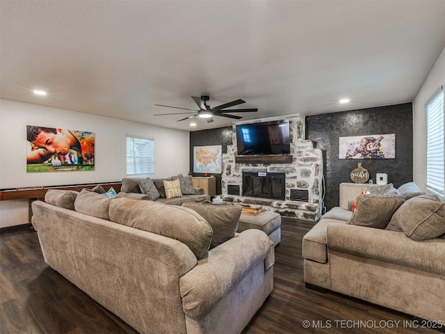 11 Port Duncan, Afton, OK 74331 - living area featuring a ceiling fan, dark wood-type flooring, healthy amount of natural light, a fireplace, and recessed lighting