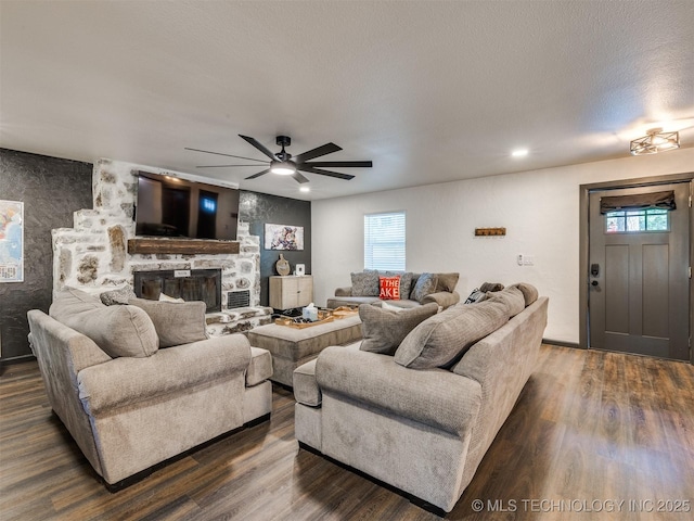 11 Port Duncan, Afton, OK 74331 - living area with ceiling fan, dark wood finished floors, and a fireplace