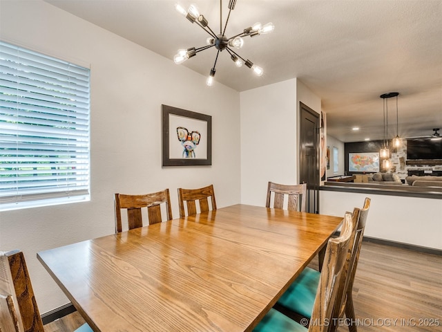 11 Port Duncan, Afton, OK 74331 - dining space featuring a chandelier and wood finished floors