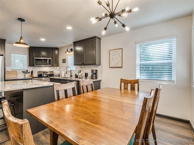 11 Port Duncan, Afton, OK 74331 - dining space featuring a chandelier, light wood-type flooring, and recessed lighting