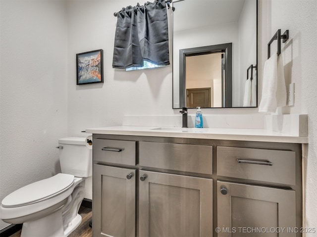 11 Port Duncan, Afton, OK 74331 - half bathroom with vanity and wood finished floors