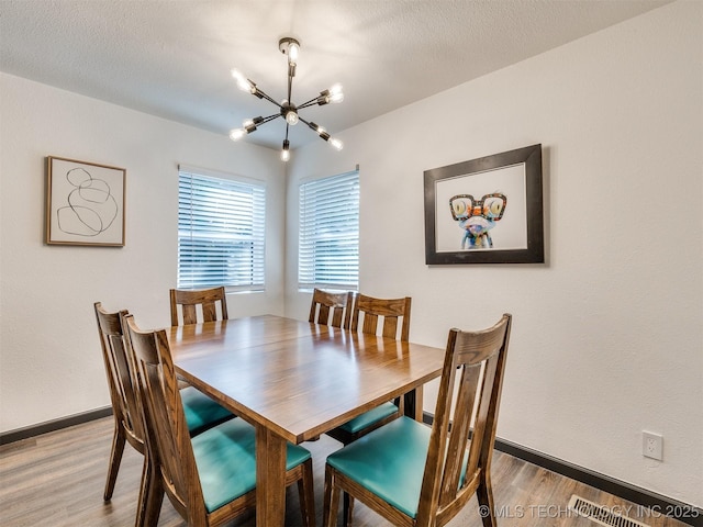 11 Port Duncan, Afton, OK 74331 - dining area featuring a chandelier and light wood finished floors