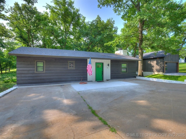 11 Port Duncan, Afton, OK 74331 - view of front of property with a chimney and an outbuilding
