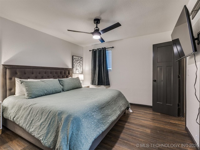 11 Port Duncan, Afton, OK 74331 - bedroom with wood finished floors, a ceiling fan, and a textured ceiling