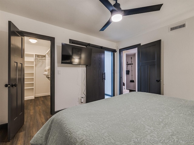 11 Port Duncan, Afton, OK 74331 - bedroom with a spacious closet, dark wood-type flooring, a closet, and a ceiling fan