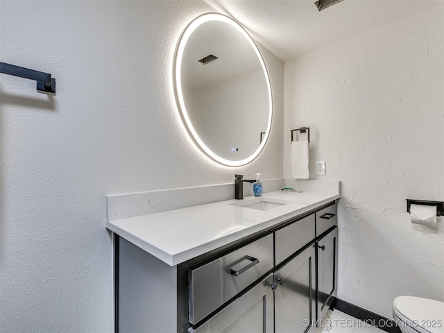 11 Port Duncan, Afton, OK 74331 - bathroom featuring vanity, a textured wall, and a textured ceiling