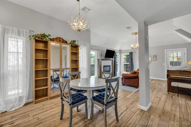 19912 E 36th St S, Broken Arrow, OK 74014 - dining space with a chandelier, light wood-style floors, and plenty of natural light