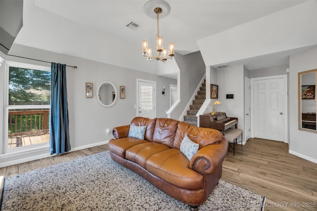 19912 E 36th St S, Broken Arrow, OK 74014 - living room with a chandelier, wood finished floors, and stairs