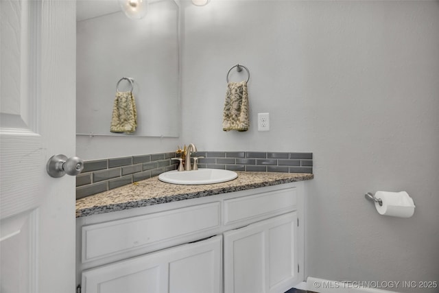 19912 E 36th St S, Broken Arrow, OK 74014 - bathroom featuring tasteful backsplash and vanity