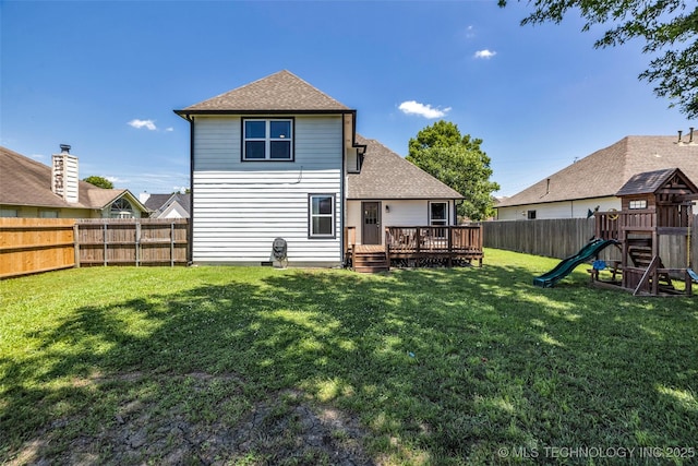 19912 E 36th St S, Broken Arrow, OK 74014 - back of house featuring a fenced backyard, a deck, roof with shingles, and a playground