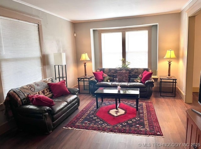 519 N 15th St, Muskogee, OK 74401 - living area featuring wood finished floors and crown molding