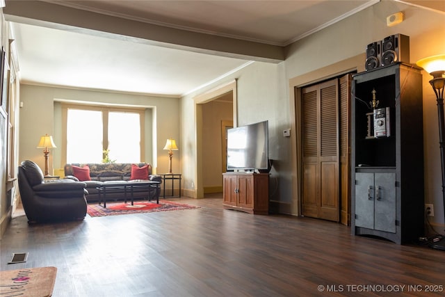 519 N 15th St, Muskogee, OK 74401 - living area featuring dark wood finished floors and crown molding