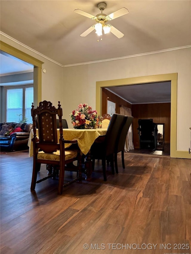 519 N 15th St, Muskogee, OK 74401 - dining area featuring dark wood-style flooring, ceiling fan, and ornamental molding