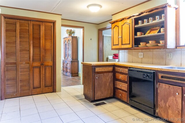 519 N 15th St, Muskogee, OK 74401 - kitchen with dishwasher, light countertops, crown molding, tasteful backsplash, and open shelves