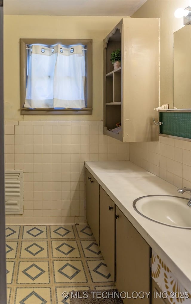 519 N 15th St, Muskogee, OK 74401 - bathroom with vanity and tile walls