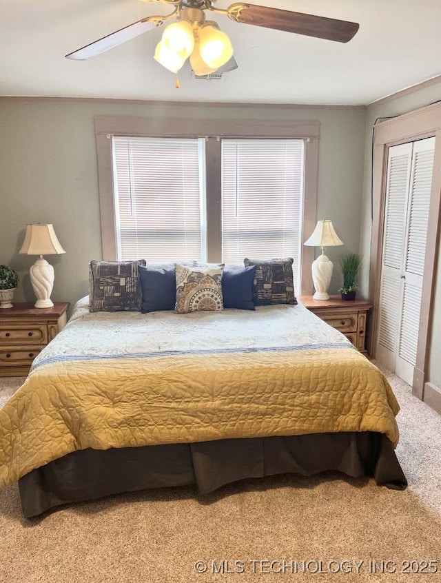 519 N 15th St, Muskogee, OK 74401 - bedroom with carpet, a closet, and a ceiling fan