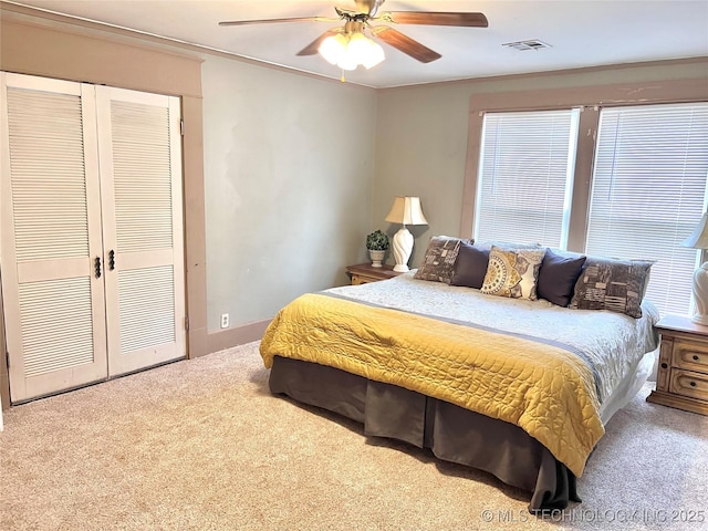 519 N 15th St, Muskogee, OK 74401 - carpeted bedroom featuring a ceiling fan and a closet