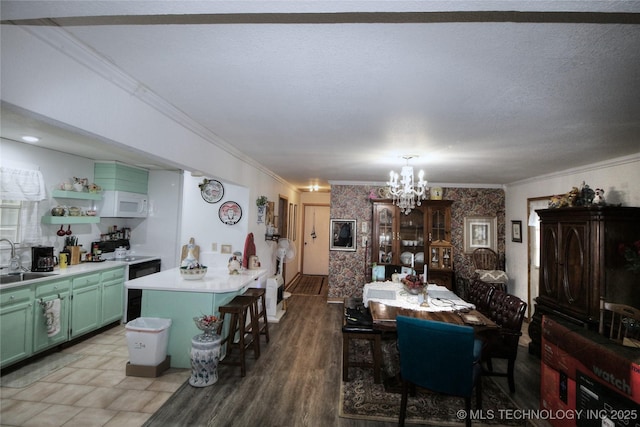 638 W Main St, Caney, OK 74533 - dining room featuring a chandelier and ornamental molding