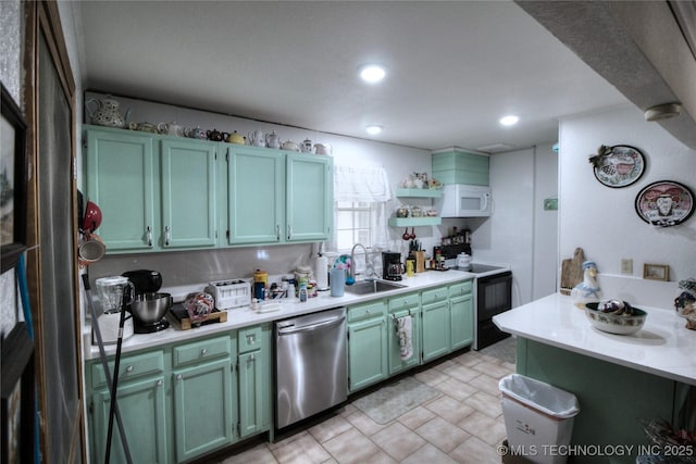 638 W Main St, Caney, OK 74533 - kitchen with dishwasher, electric range, white microwave, light countertops, and open shelves