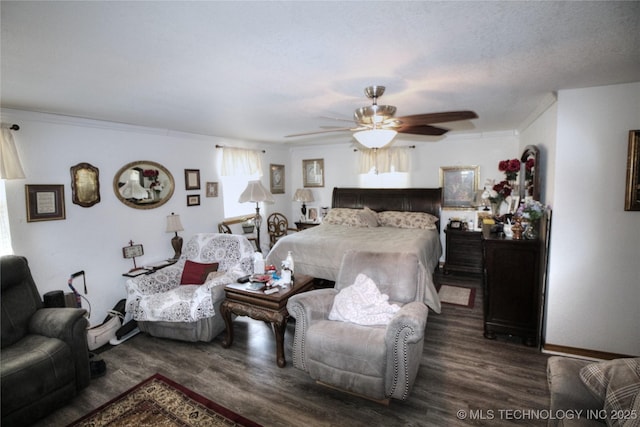 638 W Main St, Caney, OK 74533 - bedroom with wood finished floors, ornamental molding, and a ceiling fan
