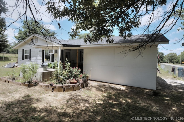 638 W Main St, Caney, OK 74533 - back of property featuring roof with shingles