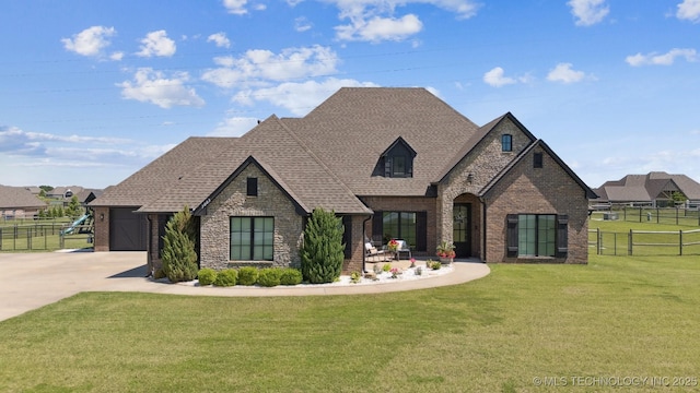 7003 E 88th St N, Owasso, OK 74055 - french country inspired facade featuring brick siding, concrete driveway, a shingled roof, and a garage