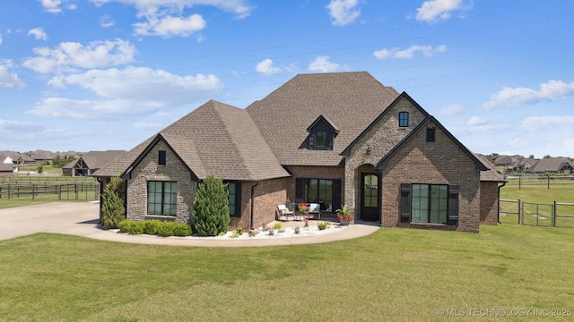 7003 E 88th St N, Owasso, OK 74055 - view of front facade featuring brick siding, roof with shingles, and stone siding