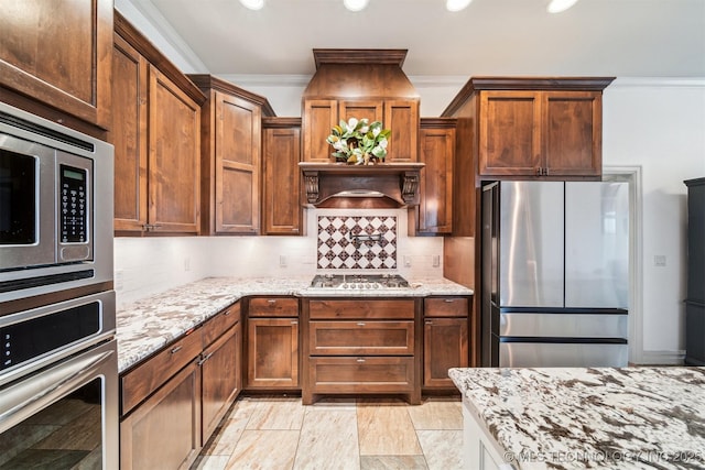 7003 E 88th St N, Owasso, OK 74055 - kitchen with appliances with stainless steel finishes, ornamental molding, light stone countertops, tasteful backsplash, and recessed lighting
