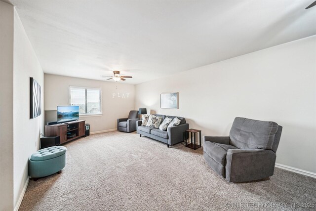 7003 E 88th St N, Owasso, OK 74055 - carpeted living area featuring ceiling fan and baseboards