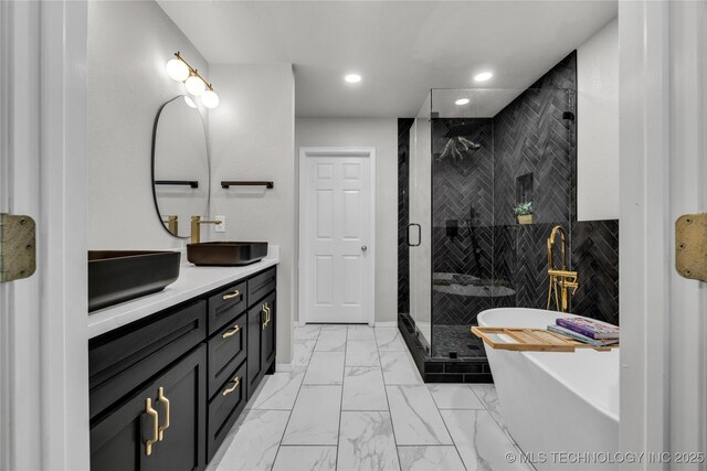 14900 E 88th St N, Owasso, OK 74055 - full bathroom featuring marble finish floors, double vanity, a soaking tub, a stall shower, and recessed lighting