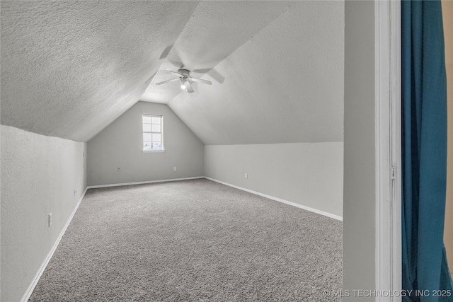 14900 E 88th St N, Owasso, OK 74055 - additional living space with ceiling fan, lofted ceiling, a textured ceiling, and carpet floors