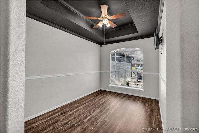 14900 E 88th St N, Owasso, OK 74055 - spare room with a tray ceiling, wood finished floors, and ceiling fan