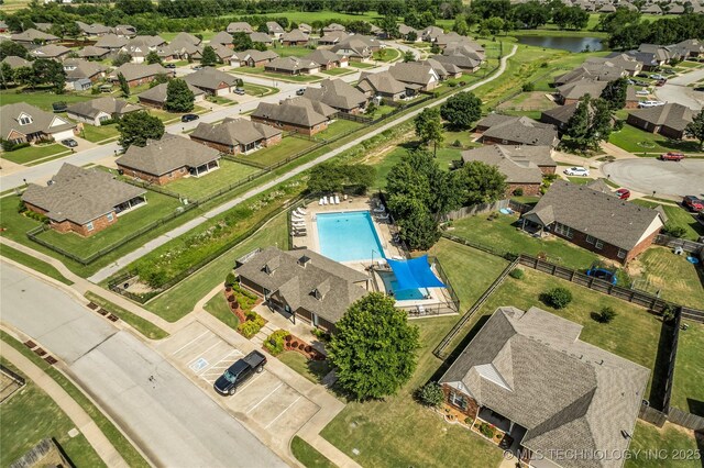14900 E 88th St N, Owasso, OK 74055 - aerial perspective of suburban area with a pool area and a nearby body of water