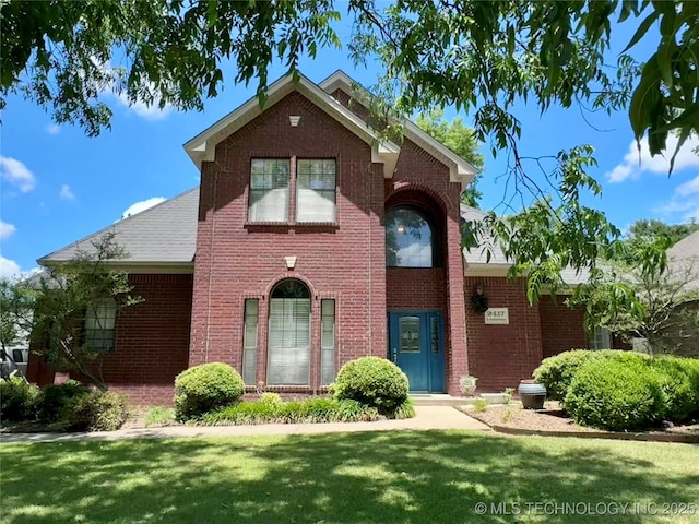 2417 S Rockford Pkwy, Ardmore, OK 73401 - traditional home featuring brick siding and a front yard