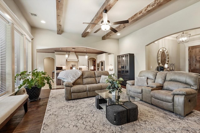 10611 N 159th E Ave, Owasso, OK 74055 - living area with arched walkways, dark wood-type flooring, a ceiling fan, recessed lighting, and beam ceiling